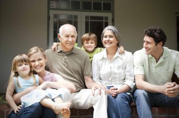 group-picture-of-three-generations-family-sitting-on-the-terrace.jpg