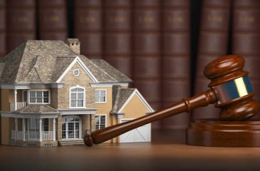 house-with-gavel-and-law-books-real-estate-law-and-house-aucti.jpg